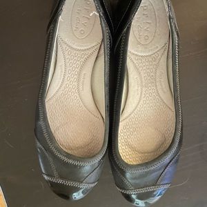 Clark’s black leather flats